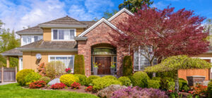 fall home with shrubs and trees