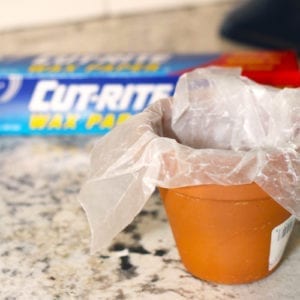 wax paper in terra cotta pot