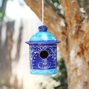 blue ceramic bird house