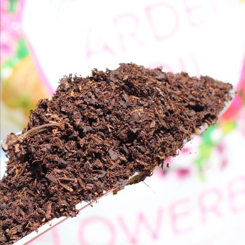 flowerbed garden soil on shovel