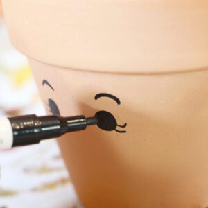 paint eyes on pottery