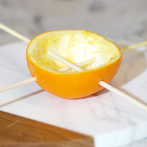 add skewers to oranges