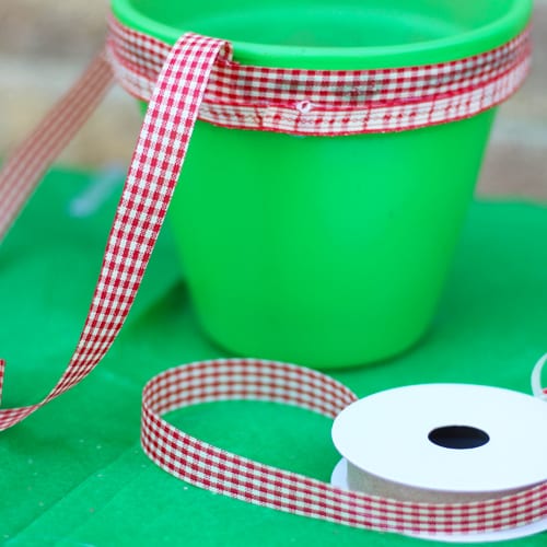 green pottery with red ribbon