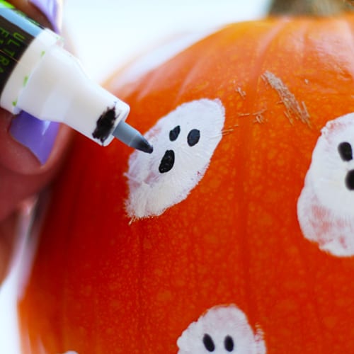 Drawing Ghost Face on Pumpkin for Fall Decoration | Calloway’s Nursery 