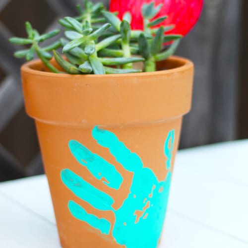 handprint pottery with plants