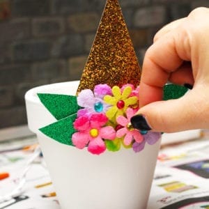 glue flowers to pottery
